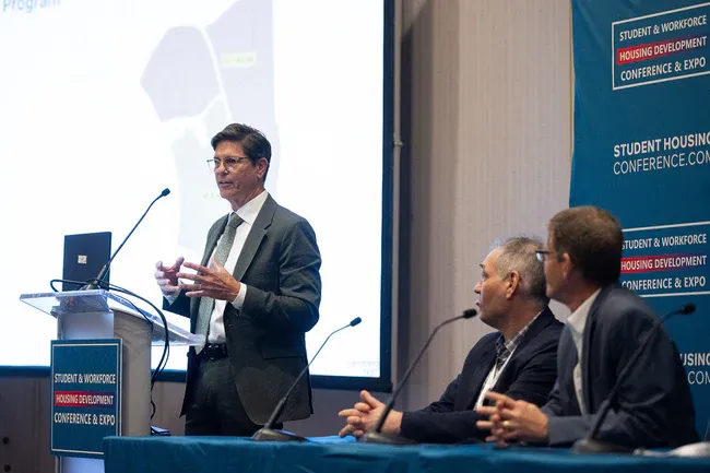 A FullStack Modular speaker presenting on a panel at the Student & Workforce Housing Development Conference & Expo